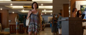 Movie still from “Mike and Dave Need Wedding Dates” (2016), directed by Jake Szymanski – A woman is walking in a hallway with a bag; Medium shot, Over the shoulder angle