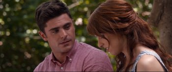 Movie still from “Mike and Dave Need Wedding Dates” (2016), directed by Jake Szymanski – A man and a woman sitting next to each other; Close Up shot, Over the shoulder angle