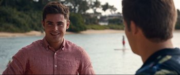 Movie still from “Mike and Dave Need Wedding Dates” (2016), directed by Jake Szymanski – Two young men standing next to a body of water; Close Up shot, Over the shoulder angle
