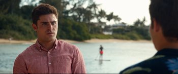 Movie still from “Mike and Dave Need Wedding Dates” (2016), directed by Jake Szymanski – A man standing in front of a body of water; Close Up shot, Over the shoulder angle