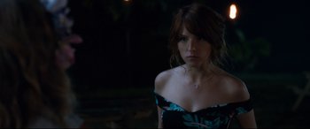 Movie still from “Mike and Dave Need Wedding Dates” (2016), directed by Jake Szymanski – A woman in a black and blue dress looking at the camera; Close Up shot, Over the shoulder angle
