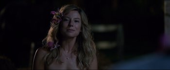 Movie still from “Mike and Dave Need Wedding Dates” (2016), directed by Jake Szymanski – A woman with long blonde hair wearing a flower in her hair; Close Up shot, Over the shoulder angle