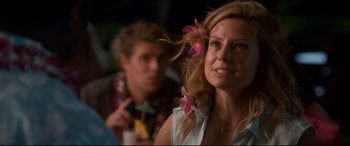 Movie still from “Mike and Dave Need Wedding Dates” (2016), directed by Jake Szymanski – A person with flowers in her hair; Close Up shot, Over the shoulder angle