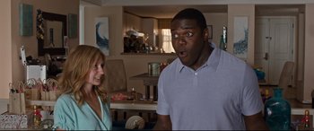 Movie still from “Mike and Dave Need Wedding Dates” (2016), directed by Jake Szymanski – A woman and a man in a living room; Medium shot, Over the shoulder angle