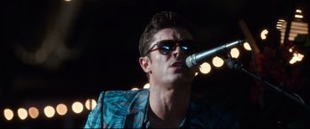 Movie still from “Mike and Dave Need Wedding Dates” (2016), directed by Jake Szymanski – A person with a microphone; Close Up shot, Low angle