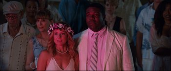 Movie still from “Mike and Dave Need Wedding Dates” (2016), directed by Jake Szymanski – A man and a woman standing next to each other in front of a crowd; Medium shot, Over the shoulder angle