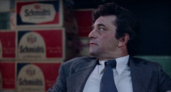 Movie still from “Mikey and Nicky” (1976), directed by Elaine May – A person wearing a suit and a tie; Close Up shot, Over the shoulder angle