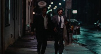 Movie still from “Mikey and Nicky” (1976), directed by Elaine May – A couple of men walking down a street at night; Wide shot, Low angle