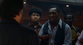 Movie still from “Mikey and Nicky” (1976), directed by Elaine May – Two men talking to each other in front of a mirror; Close Up shot, Over the shoulder angle