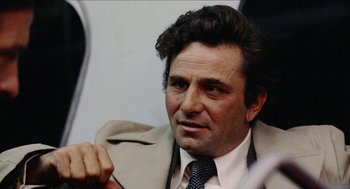Movie still from “Mikey and Nicky” (1976), directed by Elaine May – A person wearing a suit and tie; Close Up shot, Low angle