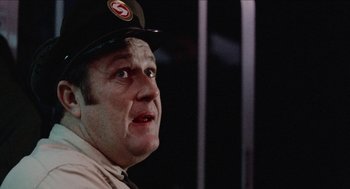 Movie still from “Mikey and Nicky” (1976), directed by Elaine May – A person wearing a hat; Close Up shot, Over the shoulder angle