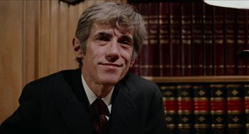 Movie still from “Mikey and Nicky” (1976), directed by Elaine May – A person wearing a suit and tie; Close Up shot, Low angle