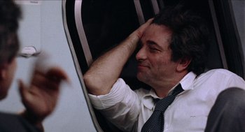 Movie still from “Mikey and Nicky” (1976), directed by Elaine May – A man sitting in a chair with his hand on his head; Close Up shot, Low angle