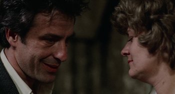 Movie still from “Mikey and Nicky” (1976), directed by Elaine May – A man and a woman face to face in a dark room; Close Up shot, Over the shoulder angle