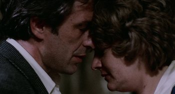 Movie still from “Mikey and Nicky” (1976), directed by Elaine May – A man and a woman face to face with their eyes closed; Close Up shot, Over the shoulder angle
