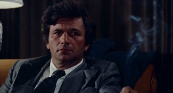 Movie still from “Mikey and Nicky” (1976), directed by Elaine May – A person wearing a suit and tie; Close Up shot, Over the shoulder angle