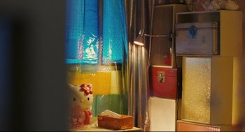 Movie still from “Millennium Mambo” (2001), directed by Hsiao-Hsien Hou – A hello kitty lamp sitting next to a window; Extreme Close Up shot, Low angle