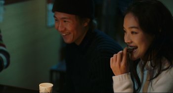 Movie still from “Millennium Mambo” (2001), directed by Hsiao-Hsien Hou – A man and a woman sitting at a dinner table; Medium shot, Over the shoulder angle