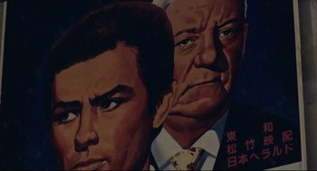 Movie still from “Millennium Mambo” (2001), directed by Hsiao-Hsien Hou – A painting of a man and an older man; Extreme Close Up shot, Low angle