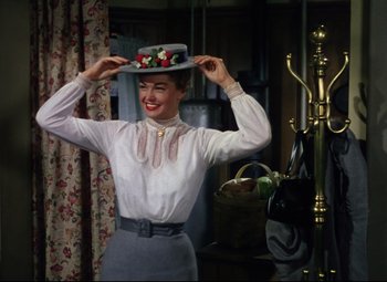 Movie still from “Million Dollar Mermaid” (1952), directed by Mervyn LeRoy – A woman in a white shirt and a white hat; Medium shot, Low angle