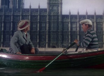 Movie still from “Million Dollar Mermaid” (1952), directed by Mervyn LeRoy – Two men are in a row boat in front of the big ben clock tower in london; Wide shot, High angle