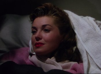 Movie still from “Million Dollar Mermaid” (1952), directed by Mervyn LeRoy – A beautiful woman laying in bed under a blanket; Close Up shot, High angle