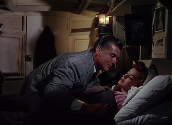 Movie still from “Million Dollar Mermaid” (1952), directed by Mervyn LeRoy – A man and a woman laying in a bed together; Medium shot, Overhead angle