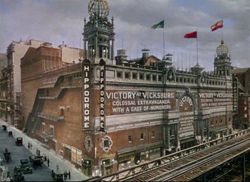 Movie still from “Million Dollar Mermaid” (1952), directed by Mervyn LeRoy – An old picture of a building with a clock tower; Extreme Wide shot, High angle