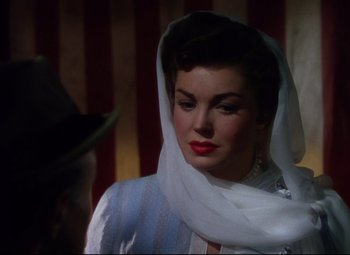 Movie still from “Million Dollar Mermaid” (1952), directed by Mervyn LeRoy – A woman with a white scarf around her neck; Close Up shot, Over the shoulder angle