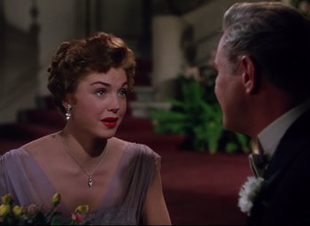 Movie still from “Million Dollar Mermaid” (1952), directed by Mervyn LeRoy – An older man and a young woman talking; Medium shot, Over the shoulder angle