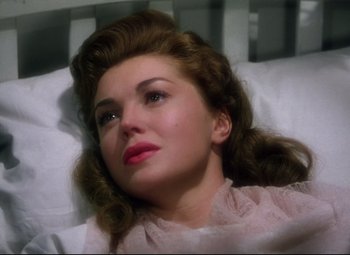 Movie still from “Million Dollar Mermaid” (1952), directed by Mervyn LeRoy – A woman laying in a bed with her eyes closed; Close Up shot, High angle