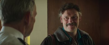 Movie still from “Mindhorn” (2016), directed by Sean Foley – A man with a mustache looking at himself in the mirror; Close Up shot, Over the shoulder angle