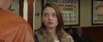 Movie still from “Mindhorn” (2016), directed by Sean Foley – A woman with blue eyes looking up at the sky; Close Up shot, Over the shoulder angle