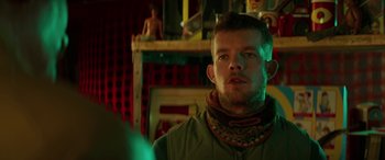 Movie still from “Mindhorn” (2016), directed by Sean Foley – A person wearing a neck brace; Close Up shot, Over the shoulder angle