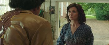 Movie still from “Mindhorn” (2016), directed by Sean Foley – A woman standing next to a man in front of a mirror; Close Up shot, Over the shoulder angle