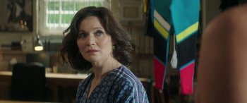 Movie still from “Mindhorn” (2016), directed by Sean Foley – A person wearing a blue shirt; Close Up shot, Over the shoulder angle