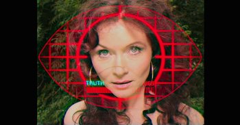 Movie still from “Mindhorn” (2016), directed by Sean Foley – A beautiful woman with red eyes and red hair; Extreme Close Up shot, Overhead angle