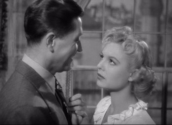 Movie still from “Ministry of Fear” (1944), directed by Fritz Lang – A man and a woman looking at one another; Close Up shot, High angle