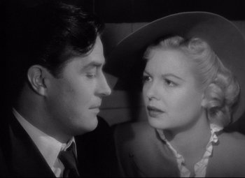 Movie still from “Ministry of Fear” (1944), directed by Fritz Lang – A man and a woman are looking at one another; Close Up shot, Low angle