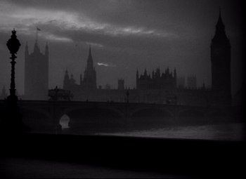 Movie still from “Ministry of Fear” (1944), directed by Fritz Lang – A black - and - white photo of a bridge and a city; Extreme Wide shot, Low angle
