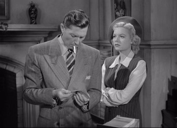 Movie still from “Ministry of Fear” (1944), directed by Fritz Lang – A man and a woman standing next to each other; Medium shot, Low angle