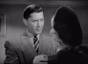 Movie still from “Ministry of Fear” (1944), directed by Fritz Lang – A man and a woman talking to each other; Close Up shot, Over the shoulder angle