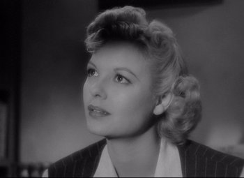 Movie still from “Ministry of Fear” (1944), directed by Fritz Lang – An old photo of a woman looking up at the sky; Close Up shot, Low angle