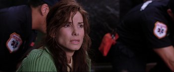 Movie still from “Miss Congeniality 2: Armed & Fabulous” (2005), directed by John Pasquin – A person with long brown hair; Close Up shot, Over the shoulder angle