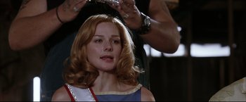 Movie still from “Miss Congeniality 2: Armed & Fabulous” (2005), directed by John Pasquin – A woman getting her hair done in a beauty salon; Close Up shot, Low angle