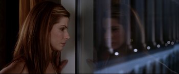 Movie still from “Miss Congeniality 2: Armed & Fabulous” (2005), directed by John Pasquin – A reflection of a young woman in a mirror; Close Up shot, Over the shoulder angle