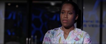 Movie still from “Miss Congeniality 2: Armed & Fabulous” (2005), directed by John Pasquin – A woman in a floral shirt is looking at the camera; Close Up shot, Low angle