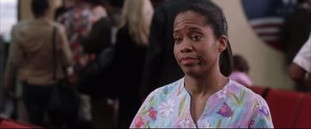 Movie still from “Miss Congeniality 2: Armed & Fabulous” (2005), directed by John Pasquin – A woman in a floral shirt looking to her left; Close Up shot, Low angle