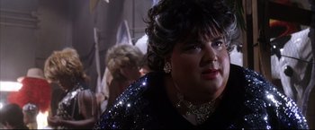 Movie still from “Miss Congeniality 2: Armed & Fabulous” (2005), directed by John Pasquin – A person wearing a dress; Close Up shot, Over the shoulder angle