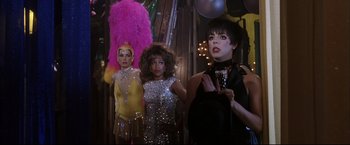 Movie still from “Miss Congeniality 2: Armed & Fabulous” (2005), directed by John Pasquin – A group of women standing next to each other; Medium shot, Over the shoulder angle